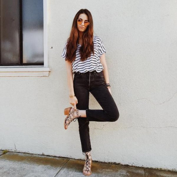 Black and white striped short-sleeve t-shirt paired with high-waisted slim-fit jeans