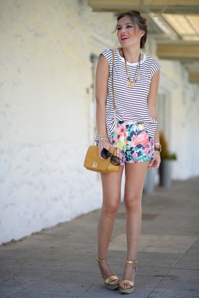 Black and white striped sleeveless tank top with floral mini shorts