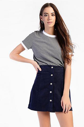 Black and white striped t-shirt with high waist corduroy skirt