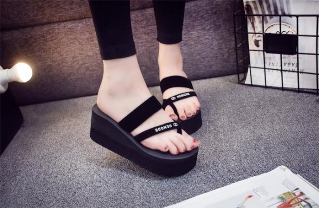 Black ankle length skinny jeans with matching wedge flip
flops