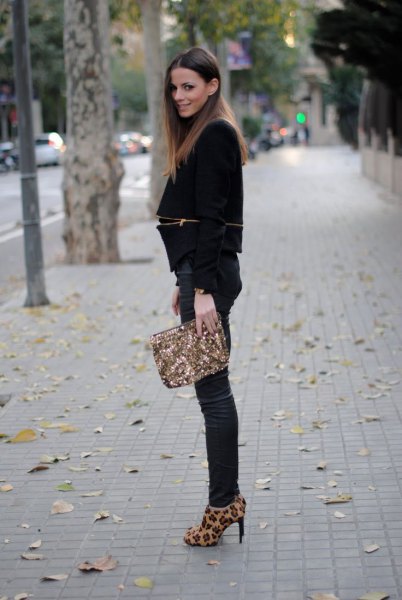 Black blazer paired with dark blue skinny jeans and animal print heels