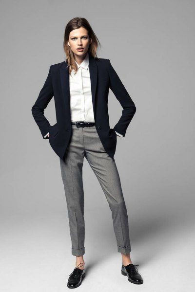 black blazer with gray cuffed trousers and oxford shoes