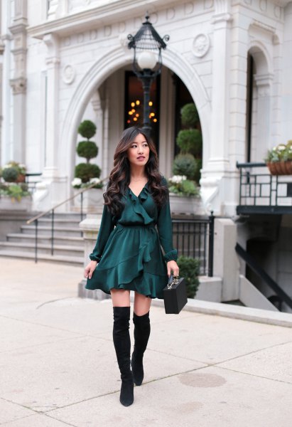 Black blouse with mini skater ruffle skirt and flat knee high boots
