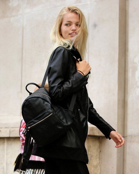 black bomber jacket with backpack and skinny jeans