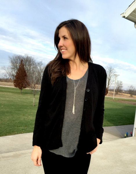 Black cardigan with gray scoop neck t-shirt and boho style
necklace