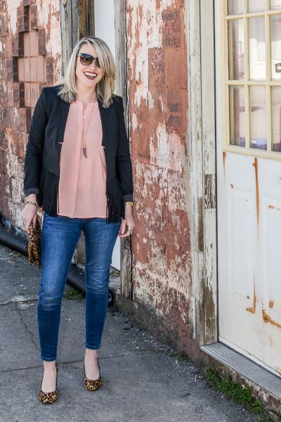 Black casual blazer with a pink chiffon blouse and blue jeans
