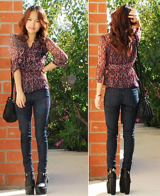 Black semi-transparent chiffon blouse with dark skinny jeans and leather ankle boots with high heels