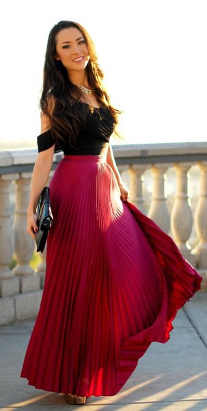 Black off shoulder top with red pleated flowy maxi skirt