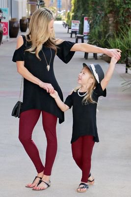Black off the shoulder tunic top with burgundy leggings