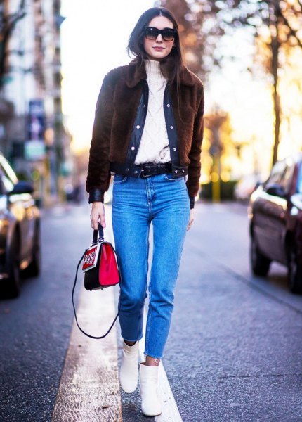 Black cord jacket with cable knit sweater and blue jeans