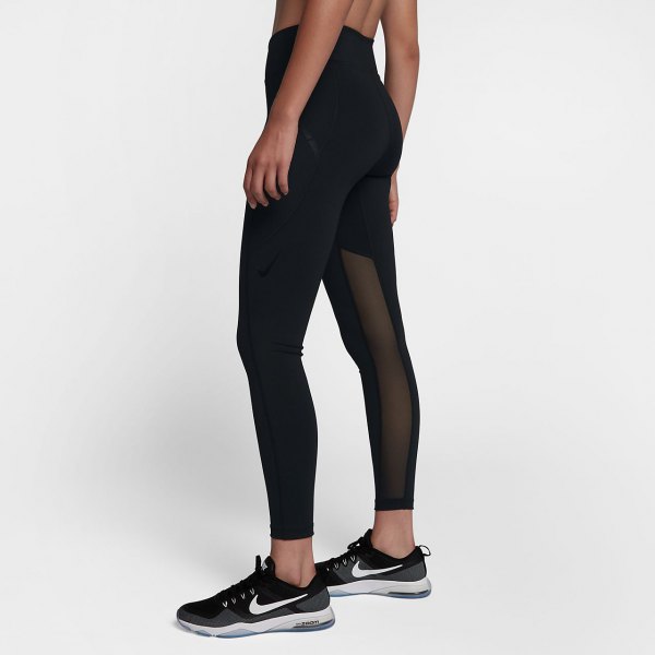 black crop top with matching high waisted semi sheer leggings and running shoes