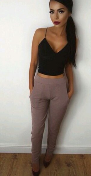 Black deep V-neck cropped tank top and gray high-waisted dress pants