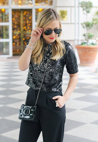 Black sequin crop top with high rise slim fit jeans