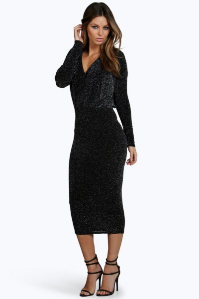 Black midi bodycon dress with a deep V-neck, long sleeves and open toe heels