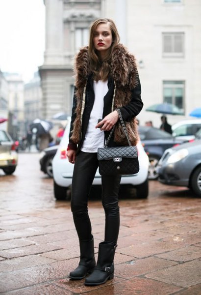 Black faux fur coat with leather pants and matte motorcycle boots