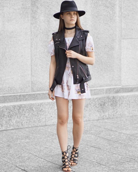 black felt hat with moto vest and white off shoulder mini chiffon dress