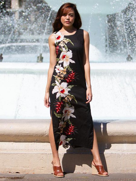 Black floral print maxi dress with side slit and brown heeled sandals