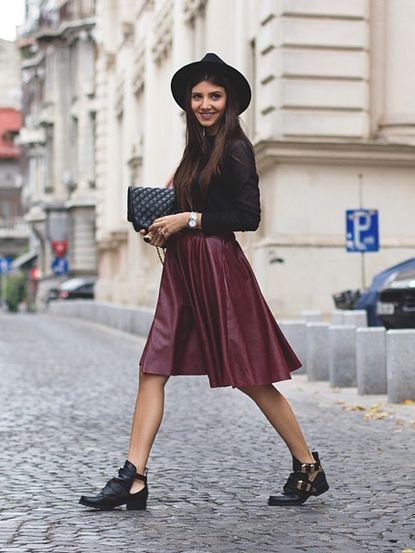 Black fitted top with silk skirt and felt hat