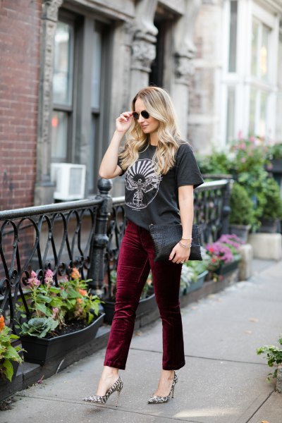 Black graphic tee with burgundy cropped velvet pants