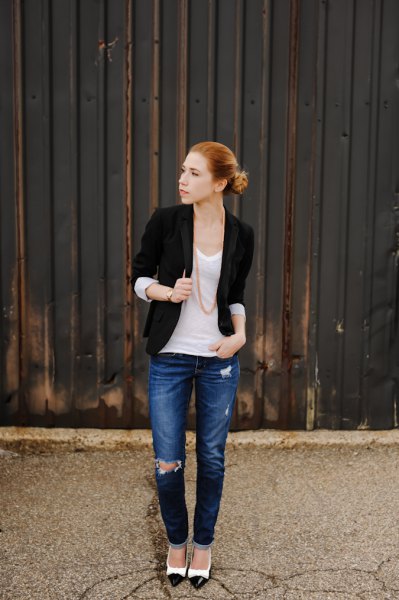 black jacket with half sleeves, white scoop neck tank top and blue jeans