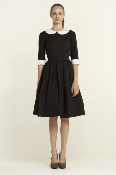 Black flared mini dress with half sleeves and a round collar
