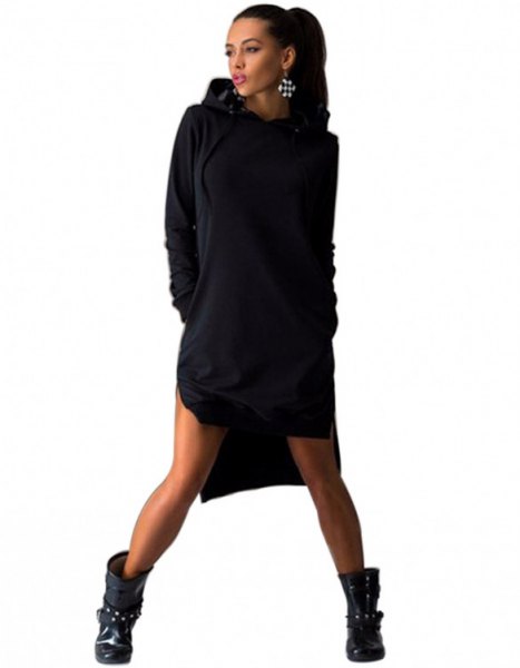 Black sweatshirt dress with a hood and leather ankle boots