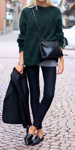 Black chunky knit sweater with dark jeans and leather low shoes