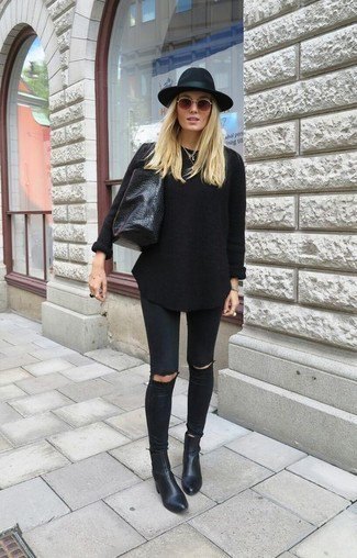 Black knit sweater with matching jeans and leather ankle boots