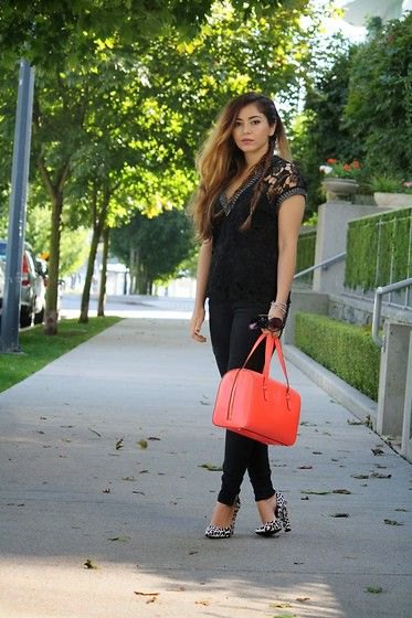 Black lace V-neck short sleeve top with orange handbag