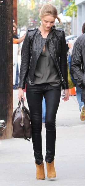black leather biker jacket with gray button down shirt and waxed jeans
