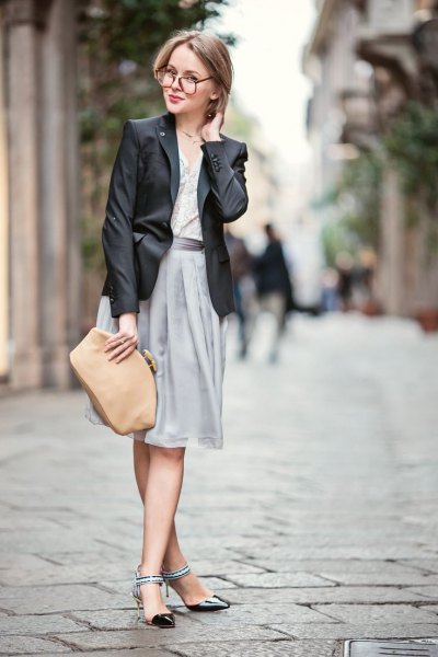 Black leather blazer with gray straight midi skirt