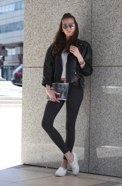 Black leather bomber jacket with a short t-shirt and white canvas sneakers