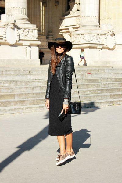Black leather jacket with floppy hat and black midi shift dress with sleeves