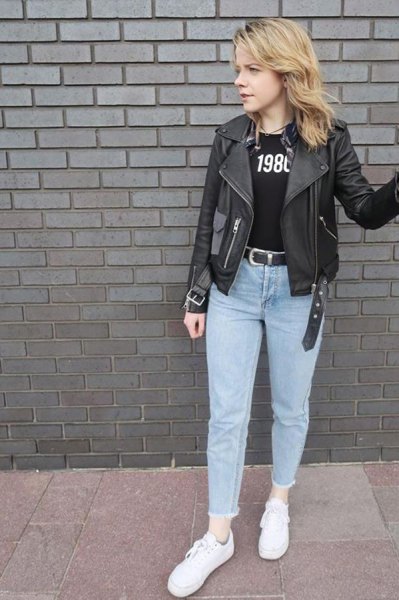 black leather jacket with printed t-shirt and light blue mom jeans
