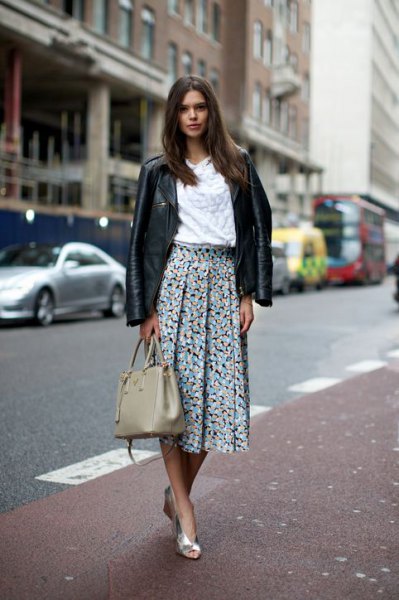 black leather jacket with white blouse and floral printed pleated
skirt