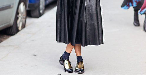 Black leather pleated midi flared dress with crew socks and gold
wintip oxfords