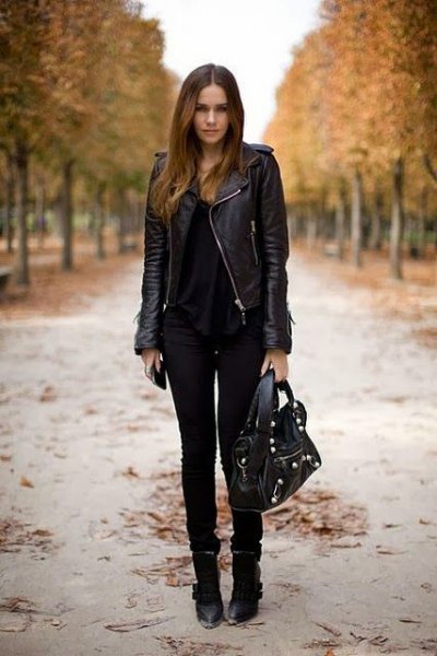 Black leather riding jacket with a scoop neck top and skinny jeans