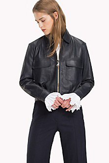 Black sporty leather coat with dark straight leg jeans