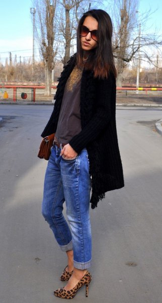 Black long cardigan with blue jeans and animal print shoes
