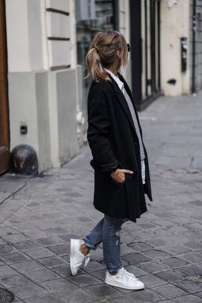 black long coat with gray sweater and white buttoned shirt