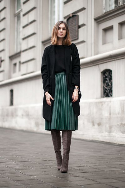 black longline blazer with gray pleated midi skirt and thigh high boots