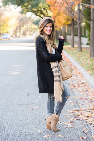 black longline cardigan sweater with striped scarf and suede
boots