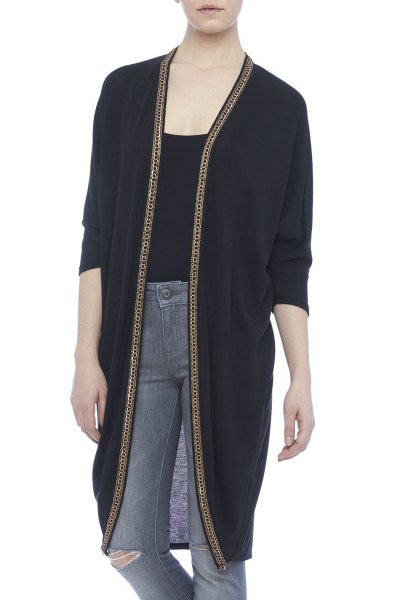 Black longline cardigan with scoop neck t-shirt and gray
jeans