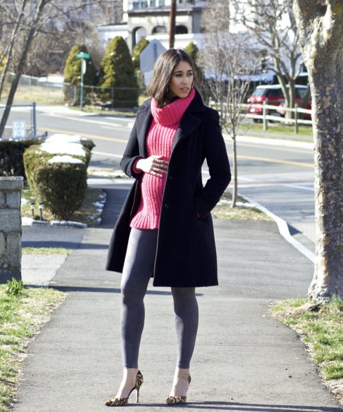 black long wool coat with pink ribbed knit sweater and gray leggings