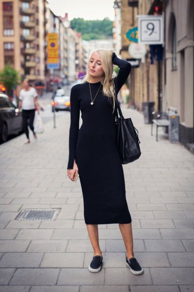 Black, figure-hugging midi dress with canvas sneakers and leather
handbag