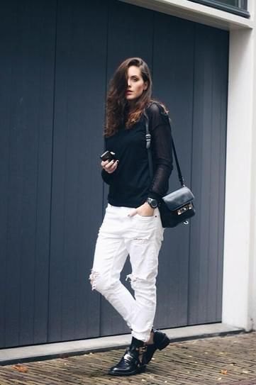 Black fitted turtleneck sweater and white boyfriend jeans