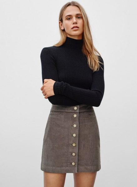 Black fitted turtleneck sweater with gray high waisted corduroy mini skirt