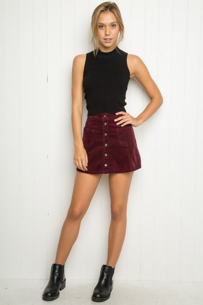 Black high neck halter top and suede mini skirt with front buttons