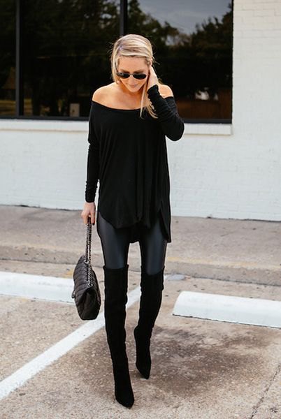 Black, off-the-shoulder tunic blouse with skinny jeans and long, flat boots