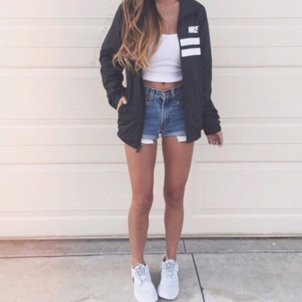 Black oversized windbreaker with white crop top and blue jean shorts